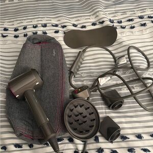 Dyson dryer with all attachments. Only used once